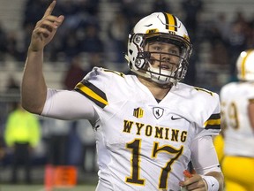 FILE - In this Oct. 22, 2016, file photo, Wyoming quarterback Josh Allen reacts after scoring a touchdown in the second half of an NCAA college football game against Nevada in Reno, Nev. Allen is expected to be a first round pick in the NFL Draft.