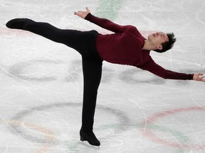 FILE - In this Feb. 17, 2018, file photo, Patrick Chan, of Canada, performs during the men's free figure skating final in the Gangneung Ice Arena at the 2018 Winter Olympics in Gangneung, South Korea. Chan, who won his long-awaited Olympic gold as part of the team event at the Pyeongchang Olympics, is retiring  after more than a decade on the world stage. Chan made his decision official Monday, April 16, 2018, after alluding to it during the Winter Games.