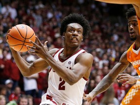 FILE - In this Feb. 10, 2018, file photo, Alabama guard Collin Sexton drives to the basket against Tennessee during the second half of an NCAA college basketball game, in Tuscaloosa, Ala. Sexton, Alabama's dynamic freshman point guard, is heading to the NBA. Sexton announced his decision on Friday, April 6, 2018, and says he plans to hire an agent.