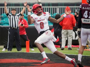 FILE - In this Dec. 30, 2017, file photo, Louisville quarterback Lamar Jackson (8) celebrates a touchdown during the first half of the TaxSlayer Bowl NCAA college football game against Mississippi State, in Jacksonville, Fla. Jackson is expected to be taken in the NFL Draft.