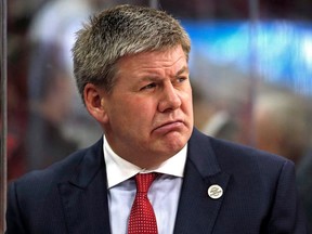 FILE - In this Feb. 10, 2018, file photo, Carolina Hurricanes head coach Bill Peters watches from the bench during the first period of an NHL hockey game against the Colorado Avalanche, in Raleigh, N.C. Peters has resigned as the Hurricanes' coach after four seasons and no playoff berths. Peters announced his decision Friday, April 20, 2018, through the team, saying in a statement that "this is a good time to move on."