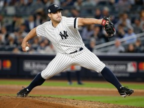 FILE - In this Oct. 18, 2017, file photo, New York Yankees relief pitcher Tommy Kahnle throws during the eighth inning of Game 5 of baseball's American League Championship Series against the Houston Astros on in New York. Kahnle has been placed on the 10-day disabled list with right shoulder tendinitis. The move was made, retroactive to Monday, before Tuesday night's game against the Miami Marlins. Kahnle is 1-0 with a 6.14 ERA in six appearances. With his velocity down this season, the right-hander has struck out nine and walked eight in 7 1/3 innings.