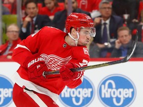 FILE - In this Jan. 31, 2018, file photo, Detroit Red Wings center Dylan Larkin (71) shoots against the San Jose Sharks in the second period of an NHL hockey game, in Detroit. Technology is available to track how fast players are skating, how hard they're shooting and how quickly they're getting the puck from end to end. Larkin would be in favor of fans seeing how fast players are skating and how hard their shooting the puck, saying it would give them a better viewing experience on TV and in arenas.
