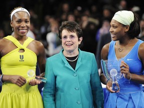 FILE - In this March 2, 2009, file photo, Billie Jean King is flanked by Venus, left, and Serena Williams after Serena defeated Venus in the championship match of the Billie Jean King Cup tennis exhibition, at Madison Square Garden in New York. Venus and Serena Williams are adding their names and voices to the push for equal pay championed by the Billie Jean King Leadership Initiative. The two current tennis stars are joining the advisory board of the group founded by the former player.