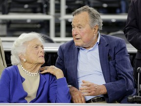 FILE - In this March 29, 2015, file photo, former President George H.W. Bush and his wife Barbara Bush, left, speak before a college basketball regional final game between Gonzaga and Duke, in the NCAA basketball tournament in Houston. A family spokesman said Sunday, April 15, 2018, that the former first lady Barbara Bush is in "failing health" and won't seek additional medical treatment.