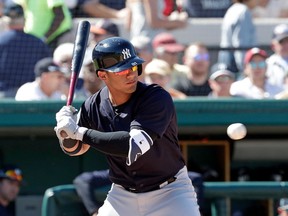 FILE - In this March 6, 2018, file photo, New York Yankees' Gleyber Torres bats against the Detroit Tigers in a spring baseball exhibition game in Lakeland, Fla. Top prospect Torres is being called up to the Yankees, a person familiar with the decision told The Associated Press. The 21-year-old infielder will join the Yankees before Sunday's game against the Toronto Blue Jays, the person said Saturday, April 21, 2018, speaking on condition of anonymity because the decision had not been announced.