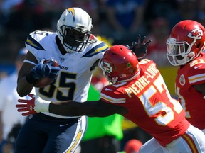 FILE - In this Sept. 24, 2017, file photo, Los Angeles Chargers tight end Antonio Gates, left, pushes aside Kansas City Chiefs linebacker Kevin Pierre-Louis during the first half of an NFL football game in Carson, Calif. Gates will not return for a 16th season with the Chargers, a person with knowledge of the decision tells The Associated Press. The person spoke on condition of anonymity Friday, April 27, 2018, because the Chargers have not publicly announced their plans for Gates.