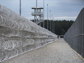 FILE - In this Feb. 9, 2016, file photo, razor wire protects a perimeter of the Lee Correctional Institution in Bishopville, S.C. A South Carolina prisons spokesman says several inmates are dead and others required outside medical attention after hours of fighting inside the maximum security prison.