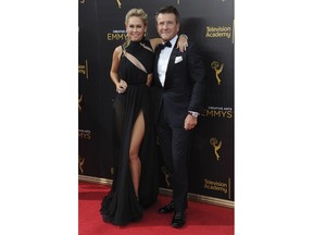 FILE - In this Sept. 11, 2016, file photo, Kym Johnson, left, and Robert Herjavec arrive at night two of the Creative Arts Emmy Awards at the Microsoft Theater in Los Angeles. Johnson and Herjavec welcomed twins into the world. Johnson posted on Instagram that their "little angels" were born on Monday, April 23, 2018.