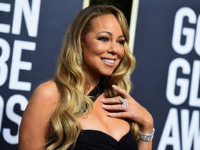 FILE - In this Jan. 7, 2018, file photo, Mariah Carey arrives at the 75th annual Golden Globe Awards at the Beverly Hilton Hotel in Beverly Hills, Calif. Carey said she's no longer living in isolation after seeking treatment for a bipolar disorder. In a People magazine article due on newsstands Friday, April 13, the singer says she didn't believe it when she was first diagnosed after she was hospitalized for a physical and mental breakdown in 2001.