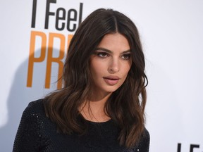 FILE - In this April 17, 2018, file photo, Emily Ratajkowski arrives at the world premiere of "I Feel Pretty" at the Westwood Village Theater in Los Angeles. The actress and model said she wasn't signaling that she was pregnant when she posted a photo of herself on Instagram with the caption "Bearing fruit." She said it was sweet people were excited, but she's "not pregnant."