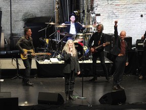 Bruce Springsteen, left, Patti Smith, center, and Michael Stipe perform after a special screening of "Horses: Patti Smith and Her Band" at the Beacon Theatre during the 2018 Tribeca Film Festival, on Monday, April 23, 2018, in New York.
