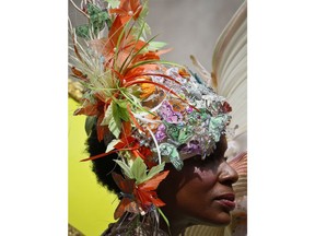 Jessica Erickson wears a hat designed by Harriet Rosebud during Easter celebrations along Fifth Avenue, Sunday April 1, 2018, in New York. The event, more of a promenade than a parade, is a take on a New York City tradition that dates back to the late 1800s. In those days, the city's richer residents would wear their best clothes and walk along after attending church services.