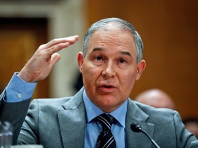 FILE - In this Jan. 30, 2018, file photo, Environmental Protection Agency administrator Scott Pruitt testifies before the Senate Environment Committee on Capitol Hill in Washington. Environmental regulators announced on Monday, April 2, 2018, they will ease emissions standards for cars and trucks, saying that a timeline put in place by President Obama was not appropriate and set standards "too high." Pruitt says the agency will work with all states, including California, to finalize new standards.