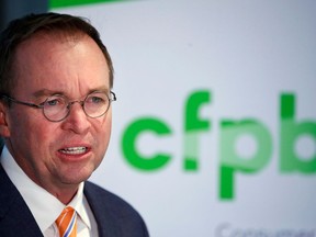 FILE - In this Nov. 27, 2017, file photo, Mick Mulvaney speaks during a news conference after his first day as acting director of the Consumer Financial Protection Bureau in Washington. Mulvaney promised to shrink the bureau's mandate and take a much softer approach to enforcement, and records reviewed by The Associated Press indicate he has kept his word.