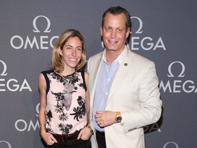 FILE- In this June 10, 2014, file photo, Nicole Mellon, left, and Matthew Mellon, right, attend the Omega Speedmaster Dark Side of the Moon launch event in New York. Billionaire banking heir Matthew Mellon has died. His cousin Peter Stephaich confirmed Mellon's death but declined Tuesday, April 17, 2018, to provide any details. He was 54.