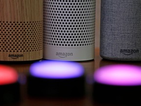 FILE - In this Sept. 27, 2017, file photo, Amazon Echo and Echo Plus devices, behind, sit near illuminated Echo Button devices during an event announcing several new Amazon products by the company in Seattle. The voice assistant that lives inside Amazon's Echo speakers will soon thank kids for shouting out questions "nicely" if they say "please." The new response is part of a kid-friendly update that's coming next month, giving parents more control over the voice assistant."