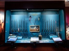 FILE - This April 4, 2017, file photo shows a display of weapons used during the Revolutionary War, including a fife and drum, at the Museum of the American Revolution in Philadelphia. The museum, which celebrates its first anniversary on April 19, has met expectations and it is in a healthy financial position.