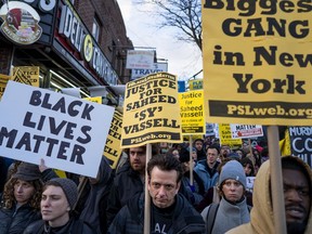 Hundreds rally for a march to the 71st Precinct on Empire Boulevard to protest Wednesday's fatal police shooting of Saheed Vassell, a 34-year-old father of a teenage son, Thursday, April 5, 2018, in the Crown Heights neighborhood of the Brooklyn borough of New York.