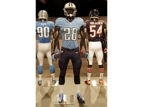 FILE - In this April 3, 2012 file photo, a Tennessee Titans uniform is displayed on a mannequin in New York. The Titans are unveiling the first major redesign of their uniforms in two decades Wednesday night, April 4, 2018.