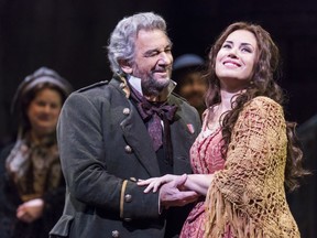 In this March 26, 2018 photo released by the Metropolitan Opera, Sonya Yoncheva, right, and Placido Domingo appear during a performance  from Verdi's "Luisa Miller" at the Metropolitan Opera. The production will be broadcast live in HD in selected theaters on Saturday.