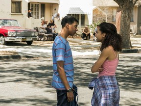 This image released by Netflix shows Brett Gray, left, and Sierra Capri in a scene from "On My Block." The new teen dramedy attempts to tackle race and poverty with John Hughes 1980s-style humor. Set in a fictional working-class Latino and black Southern California neighborhood, teens work through typical issues of love and acceptance despite the gang violence and constant police presence.
