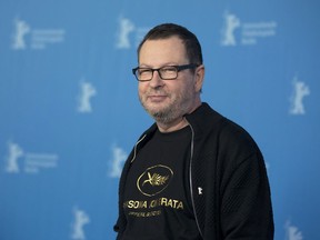 FILE - In this Feb. 9, 2014, photo, director Lars von Trier poses for photographers at a photo call for the film "Nymphomaniac" at the International Film Festival Berlinale in Berlin. Seven years after being banned by the Cannes Film Festival for jokingly calling himself a Nazi, Danish director Lars von Trier has been invited back to the French festival. Von Trier was declared "persona non grata" by Cannes after expressing sympathy for Adolf Hitler in a 2011 press conference for his film "Melancholia."