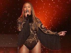 FILE - In this June 26, 2016, file photo, Beyonce performs "Freedom" at the BET Awards in Los Angeles. When Beyonce paid tribute to historically black colleges at Coachella, the singer's grand performance reignited interest in the marching band culture creating shockwaves of excitement to students attending those schools. Many from the black community are praising Beyonce for shedding light on HBCUs. Her high-energy festival set over the weekend involved a marching band, dance troupes and step teams from black colleges along with her singing "Lift Every Voice and Sing," known as the national black anthem.