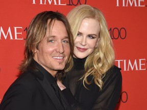 FILE - In this April 24, 2018 file photo, Keith Urban, left, and Nicole Kidman attend the Time 100 Gala celebrating the 100 most influential people in the world in New York. On Urban's new record, "Graffiti U," Kidman added backing vocals to his single, "Female," a song that was inspired by the #MeToo movement, and Urban says she was the inspiration for at least two other songs on the album that came out April 27.
