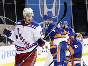 New York Rangers' Kevin Hayes (13) celebrates after scoring a goal as New York Islanders goaltender Jaroslav Halak (41) reacts during the first period of an NHL hockey game Thursday, April 5, 2018, in New York.