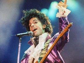 FILE - In this Feb. 18, 1985 file photo, Prince performs at the Forum in Inglewood, Calif. Prince's heirs have sued Walgreens and the Illinois hospital that treated the music superstar after he suffered from an opioid overdose, alleging that a doctor and various pharmacists failed to provide Prince with reasonable care, contributing to his death.
