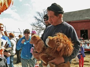 FILE – In this April 4, 2015, file photo, Kenny Hetrick, owner of Tiger Ridge Exotics, holds stuffed toy animals as he speaks to visitors at an Easter egg hunt fundraiser in Stony Ridge, Ohio. The Hetrick family, whose tigers and other exotic animals were seized in a raid by Ohio authorities, lost what's likely their final court challenge seeking the animals return to their roadside sanctuary. The state's agriculture department said the decision issued Wednesday, April 25, 2018, will allow it to begin handing over permanent ownership of the animals to the sanctuaries where they now are housed.