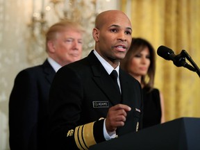 FILE - In this Feb. 13, 2018, file photo, Surgeon General Jerome Adams speaks during a National African American History Month reception hosted by President Donald Trump and first lady Melania Trump in the East Room of the White House in Washington. The nation's chief doctor wants more Americans to start carrying the overdose antidote naloxone in an effort to combat the nation's opioid crisis. U.S. Surgeon General Dr. Adams is expected to speak about the public health advisory Thursday, April 5, at the National Rx Drug Abuse & Heroin Summit in Atlanta.