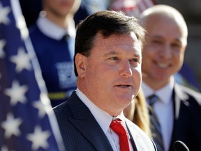 FILE - In this Aug. 9, 2017, file photo, Indiana Rep. Todd Rokita speaks during a news conference outside of the Indiana Statehouse in Indianapolis. Rokita likely violated ethics laws as Indiana's secretary of state by repeatedly accessing a Republican donor database from his government office, prompting party officials to lock him out of the system until he angrily complained, three former GOP officials told The Associated Press.