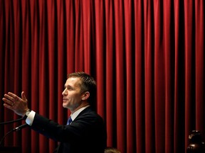 In this Jan. 10, 2018, photo, Missouri Gov. Eric Greitens delivers the annual State of the State address to a joint session of the House and Senate in Jefferson City, Mo. Facing mounting calls to resign following sexual misconduct allegations, Missouri Gov. Eric Greitens appears to be taking a cue from President Donald Trump as he fights for his political survival amid a #MeToo movement that has felled dozens of other prominent politicians and public figures.