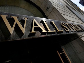 This April 5, 2018, photo shows a building's address on Wall Street, in New York. The U.S. stock market opens at 9:30 a.m. EDT on Monday, April 9.