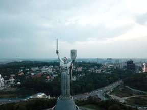 This Sept. 21, 2017 photo shows the 500-ton Motherland Monument which sits on the bank of the Dnieper River in Kiev, Ukraine. The grand statue commemorates the Soviet's defeat of the Nazis during World War II.