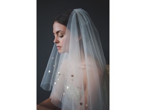 This photo provided by Etsy shows a fingertip-length tulle veil with starry trim which Katy Howieson makes in her Sedgefield, England studio. (What Katy Did Next/Etsy via AP)