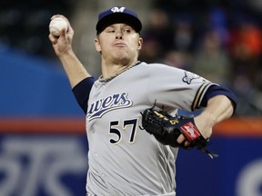 Milwaukee Brewers' Chase Anderson delivers a pitch during the first inning of the team's baseball game against the New York Mets on Saturday, April 14, 2018, in New York.