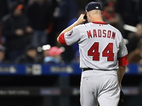 Washington Nationals relief pitcher Ryan Madson leaves the field after allowing a two-run double to New York Mets' Juan Lagares in the eighth inning of a baseball game, Wednesday, April 18, 2018, in New York.