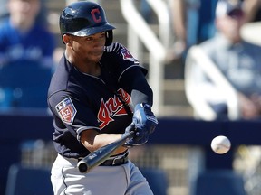 FILE  - In this Feb. 26, 2018 file photo Cleveland Indians' Francisco Mejia connects for a two-run home run during the fifth inning of a spring training baseball game against the Milwaukee Brewers in Maryvale, Ariz. Mejia is suing a company he claims gave him $360,000 in exchange for a 10-percent stake in his future earnings that could end up amounting to many millions of dollars.