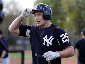 FILE - This Feb. 23, 2018 file photo shows New York Yankees' Brandon Drury (29) walking off the field after batting practice before a spring training baseball game against the Detroit Tigers in Tampa, Fla.  Drury says he has batted in big league games with blurred vision caused by migraines. He has not played since April 6 and has been undergoing tests for the cause of the migraines. He resumed baseball activities before Monday's homestand opener against Miami and said he has been put on an anti-inflammatory medication. Drury said not all the test results have come back and the issues have not yet subsided.