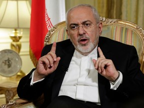 Iran's Foreign Minister Mohammad Javad Zarif is interviewed by The Associated Press, in New York, Tuesday, April 24, 2018. Zarif is warning the Trump administration that pulling out from the Iran nuclear deal would undermine talks with North Korea by proving that America reneges on its promises.