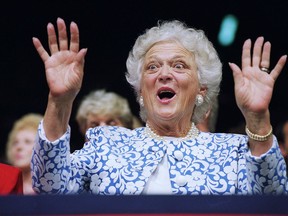 FILE - In this Aug. 18, 1992, file photo, first lady Barbara Bush reacts to Sen. Phil Gramm, who delivered the keynote address to the Republican National Convention at the Houston Astrodome. A family spokesman said Tuesday, April 17, 2018, that former first lady Barbara Bush has died at the age of 92.