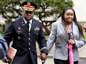 FILE - In this May 9, 2013, file photo, John Jackson, left, and his wife, Carolyn Jackson, of Mount Holly, N.J., walk out of Martin Luther King Jr. Courthouse in Newark, N.J. The couple, who've been convicted of abusing their young foster children over several years, are due back in court Wednesday, April 11, 2018, for a resentencing after their original sentence was thrown out for being too lenient.