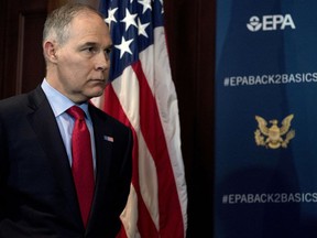 FILE - In this Tuesday, April 3, 2018, file photo, Environmental Protection Agency Administrator Scott Pruitt attends a news conference at the EPA in Washington, on his decision to scrap Obama administration fuel standards. The fossil-fuels lobbyist tied to the bargain-priced Capitol Hill condo leased by Pruitt is taking early retirement as a result of the scandal.