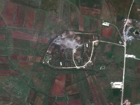 This satellite image provided by DigitalGlobe shows the Him Shinshar Chemical Weapons Storage Facility in Syria on Saturday, April 14, 2018, following a U.S.-led allied missile attack. U.S., French and British warplanes and ships launched more than 100 missiles nearly unopposed by Syrian air defenses early Saturday. (Satellite Image ©2018 DigitalGlobe via AP)  THE DIGITALGLOBE WATERMARK MAY NOT BE REMOVED