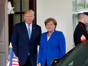 A bird flies past as President Donald Trump greets German Chancellor Angela Merkel, Friday April 27, 2018, at the White House in Washington. Donald Trump and Emmanual Macron? Judging from the body language, mon ami! The president and Germany's Angela Merkel? Ach, not so chummy.