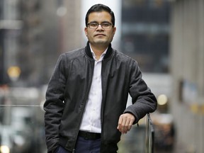 In this Tuesday, Feb. 20, 2018 photo, Akash Negi poses for a picture near his office in New York. Donald Trump says he wants more "merit-based" immigrants as opposed to those who arrive due to family ties, but his administration has taken steps to make life difficult for those skilled immigrants already in the U.S. Negi moved to the United States after his father got a diplomatic visa as part of a job at the United Nations, but his legal residency doesn't include a work permit.
