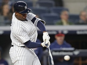 New York Yankees' Miguel Andujar hits a second-inning solo home run during a baseball game against the Minnesota Twins in New York, Monday, April 23, 2018.